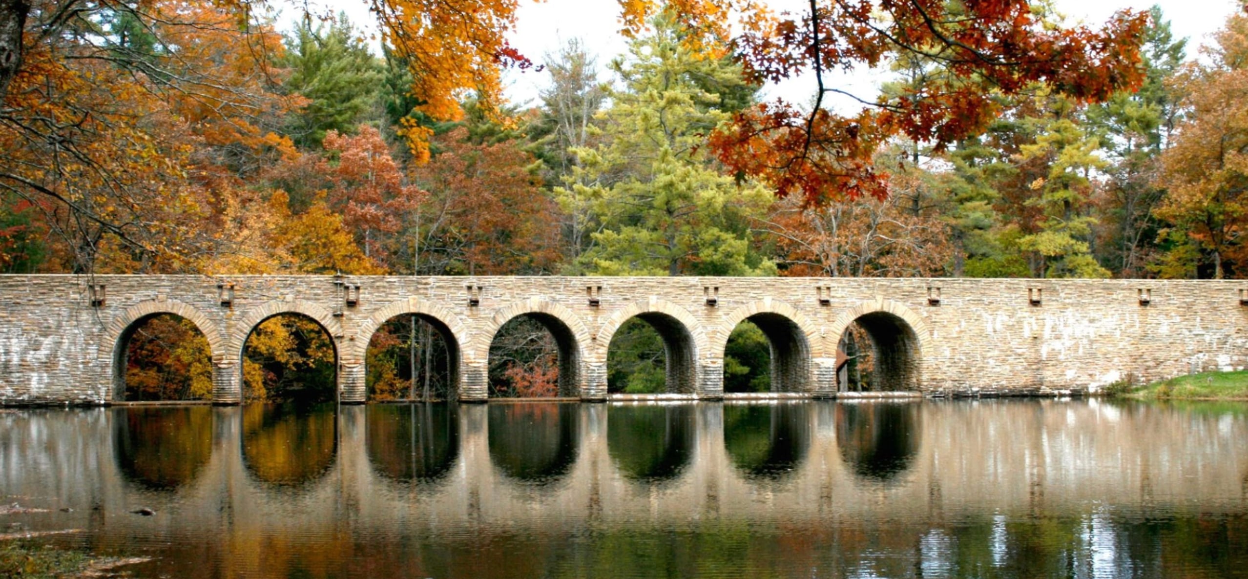 Historic stone bridge over the lake at Cumberland Mountain State Park near Crossville, Tennessee