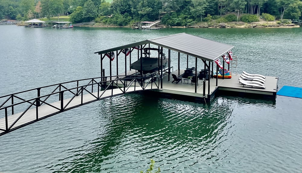 Covered boat dock with boat lift and lounge area on Norris Lake, TN